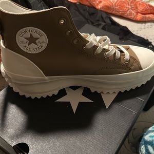 2 adidas suits and a Nike sweatsuit and some converse and some crocs